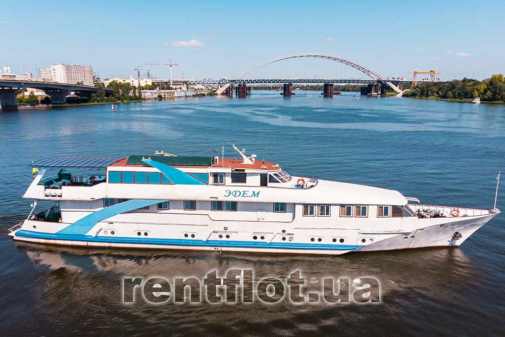 Enlarge photo of the ship Edem against the background of the city Motor ship Edem on the background of the city
