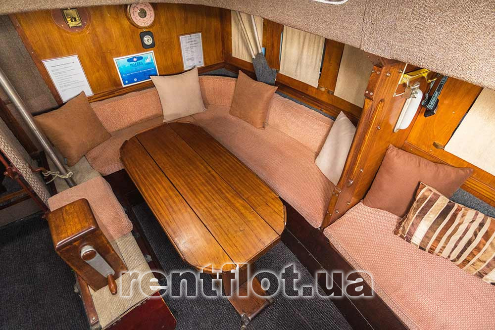 Enlarge the photo of the spread out table in the saloon of the sailing yacht Rif Unfolded table in the saloon of sailing yacht Rif