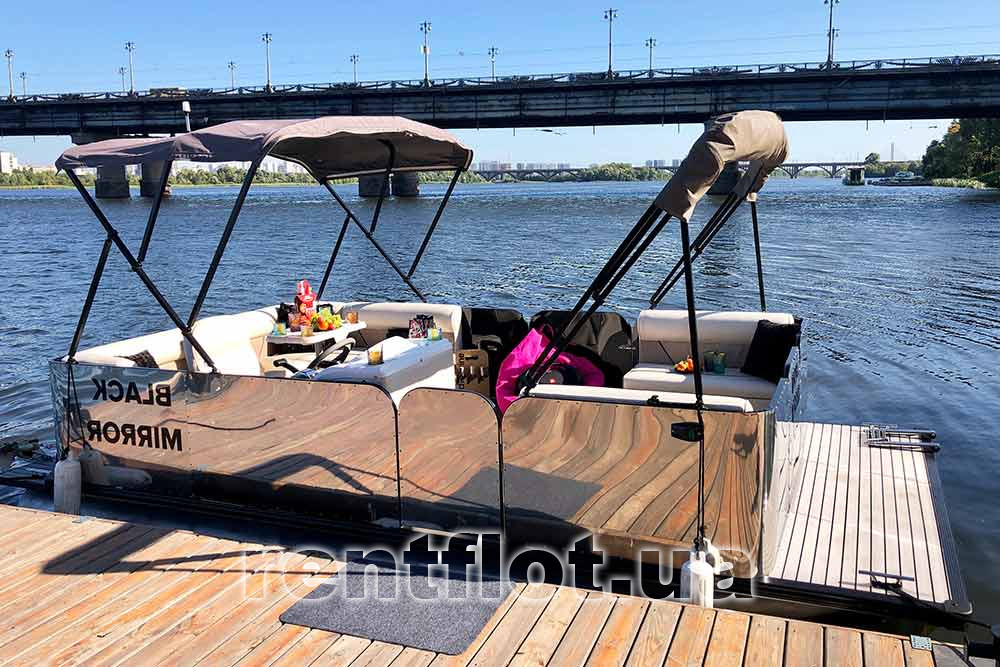 Enlarge photo of the Black Mirror boat at the pier The Black Mirror boat at the pier