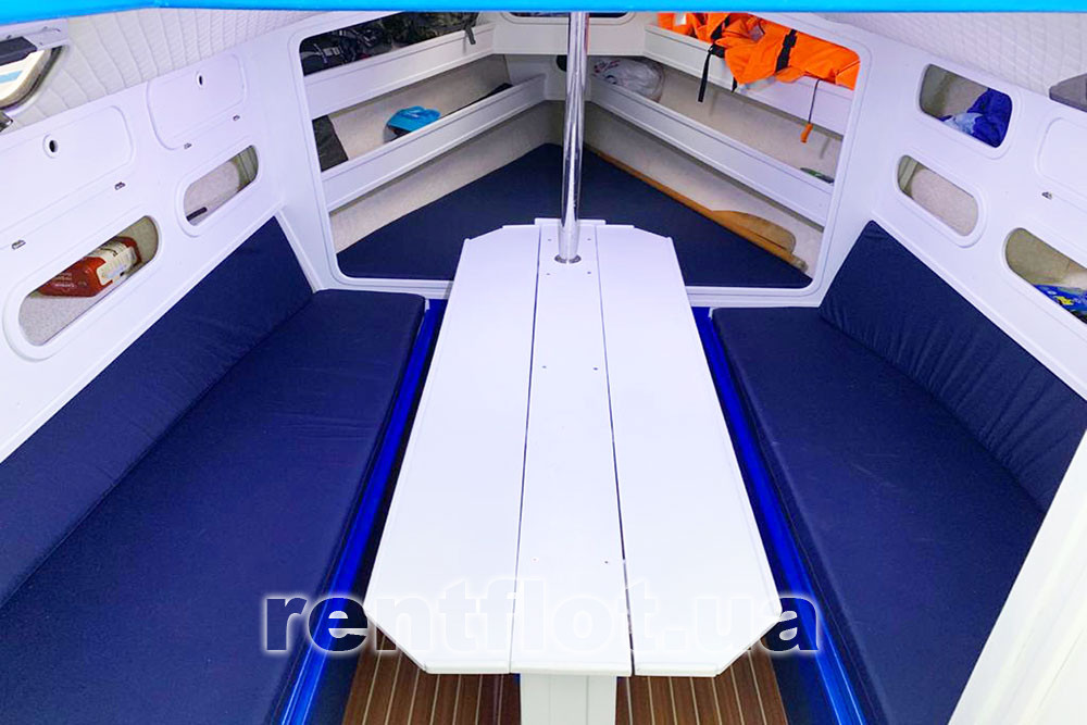 Enlarge the photo of the spread out table in the saloon of sailing yacht Marco Unfolded table in the saloon of sailing yacht Marco