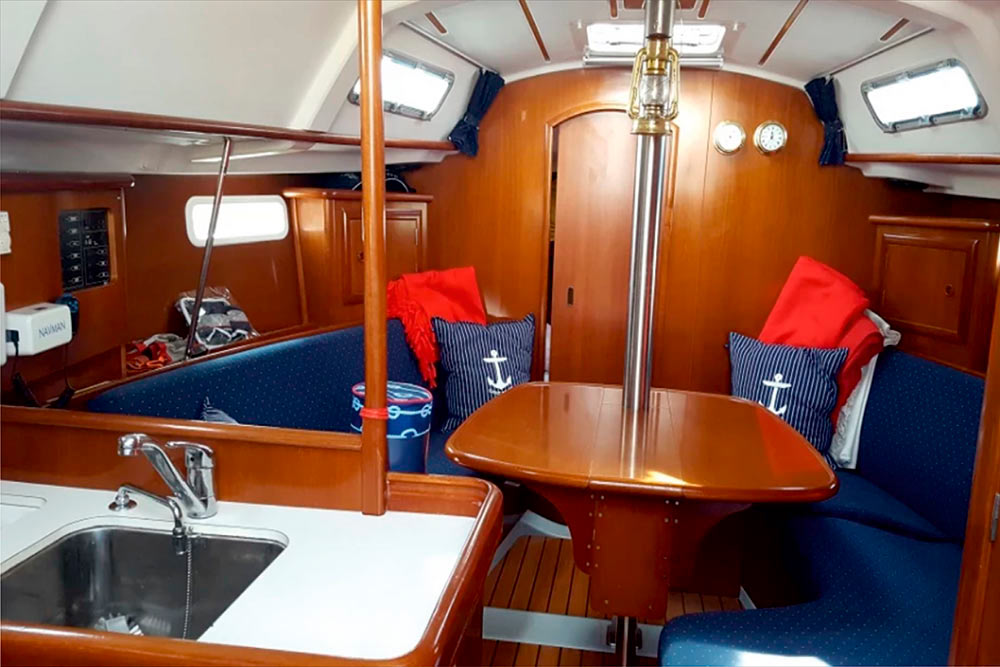 Enlarge photo of the table for the banquet in the saloon of sailing yacht Benetu-331 Ksenia Banquet table in the saloon of sailing yacht Benetu-331 Ksenia