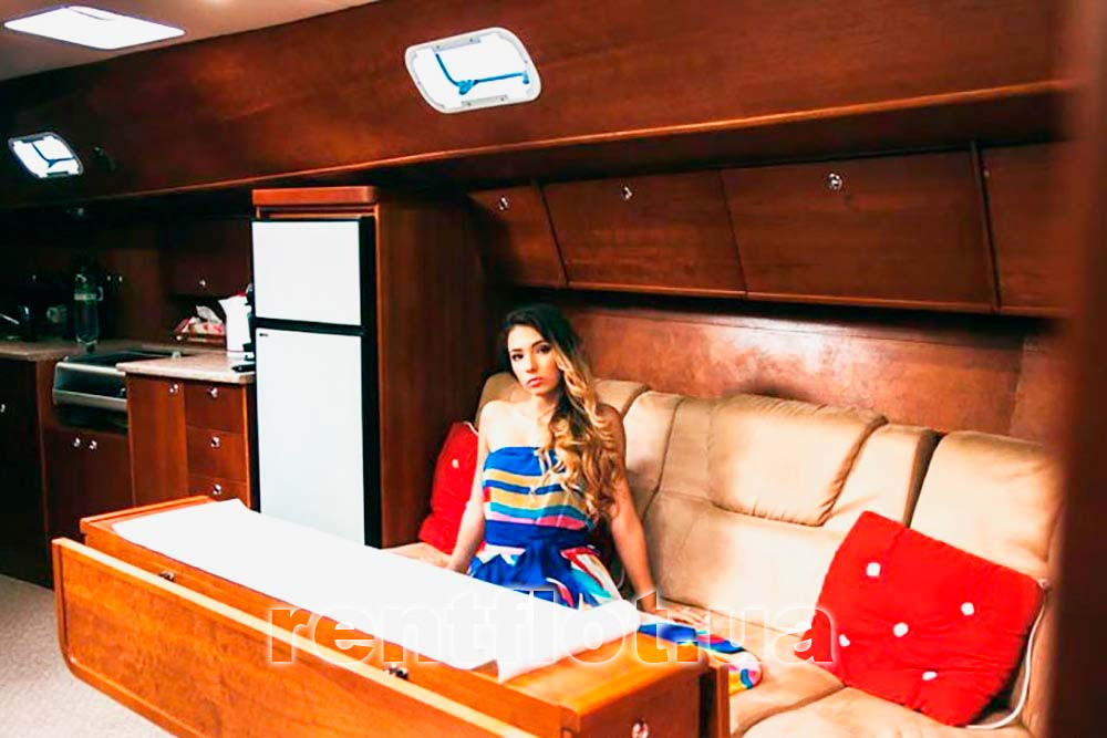 Enlarge the photo at the table in the saloon of the sailing yacht Olga At the table in the saloon of the sailing yacht Olga